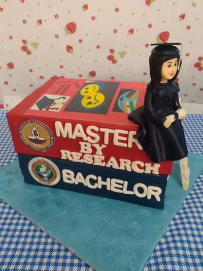 Stacked books graduation cake