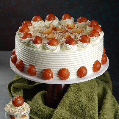 Send cake with pista and gulab jamun topping online by GiftJaipur in  Rajasthan